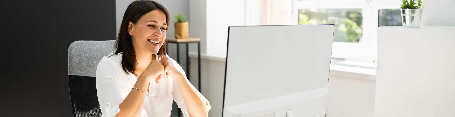 Business Digital Banking  Demos - Woman on Computer in Office Environment 