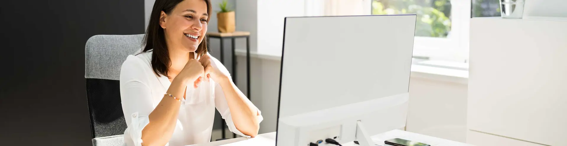 Business Digital Banking  Demos - Woman on Computer in Office Environment 