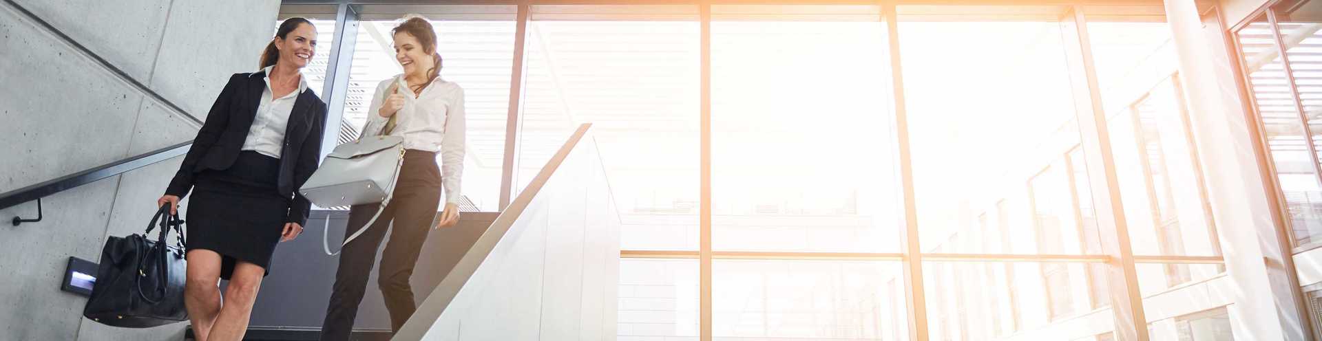 Commercial Checking Account Options - Two Women Professionals in an Office Building