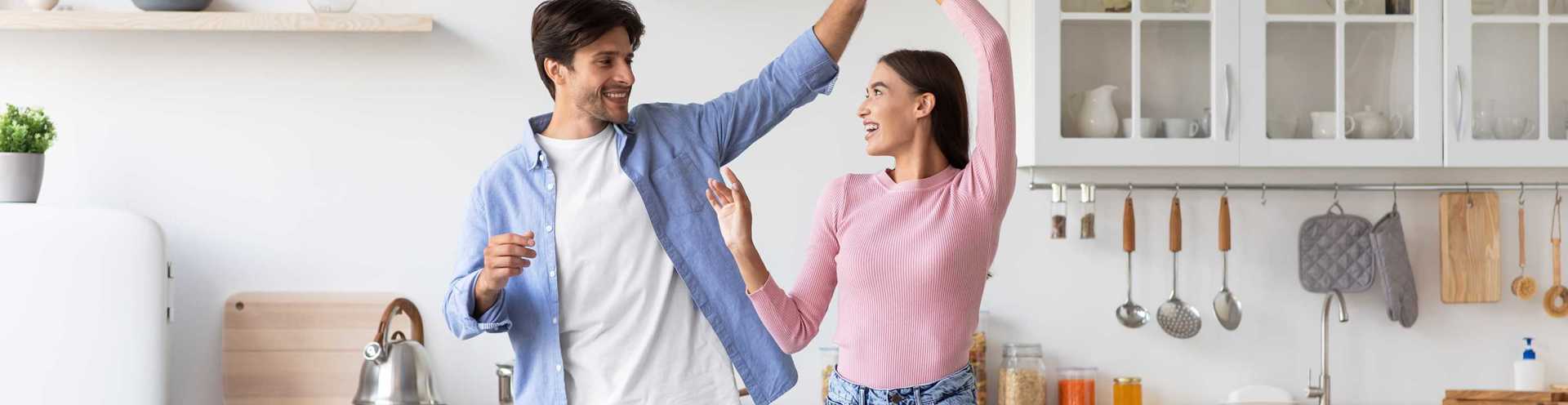 High Yield Money Market Account - Couple in Kitchen Dancing